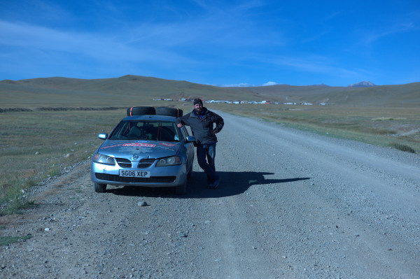 Matt and Jon Hay pose after successfully crossing into Mongolia from Russia.